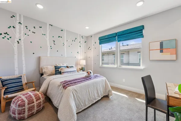a bedroom with a bed furniture and a window
