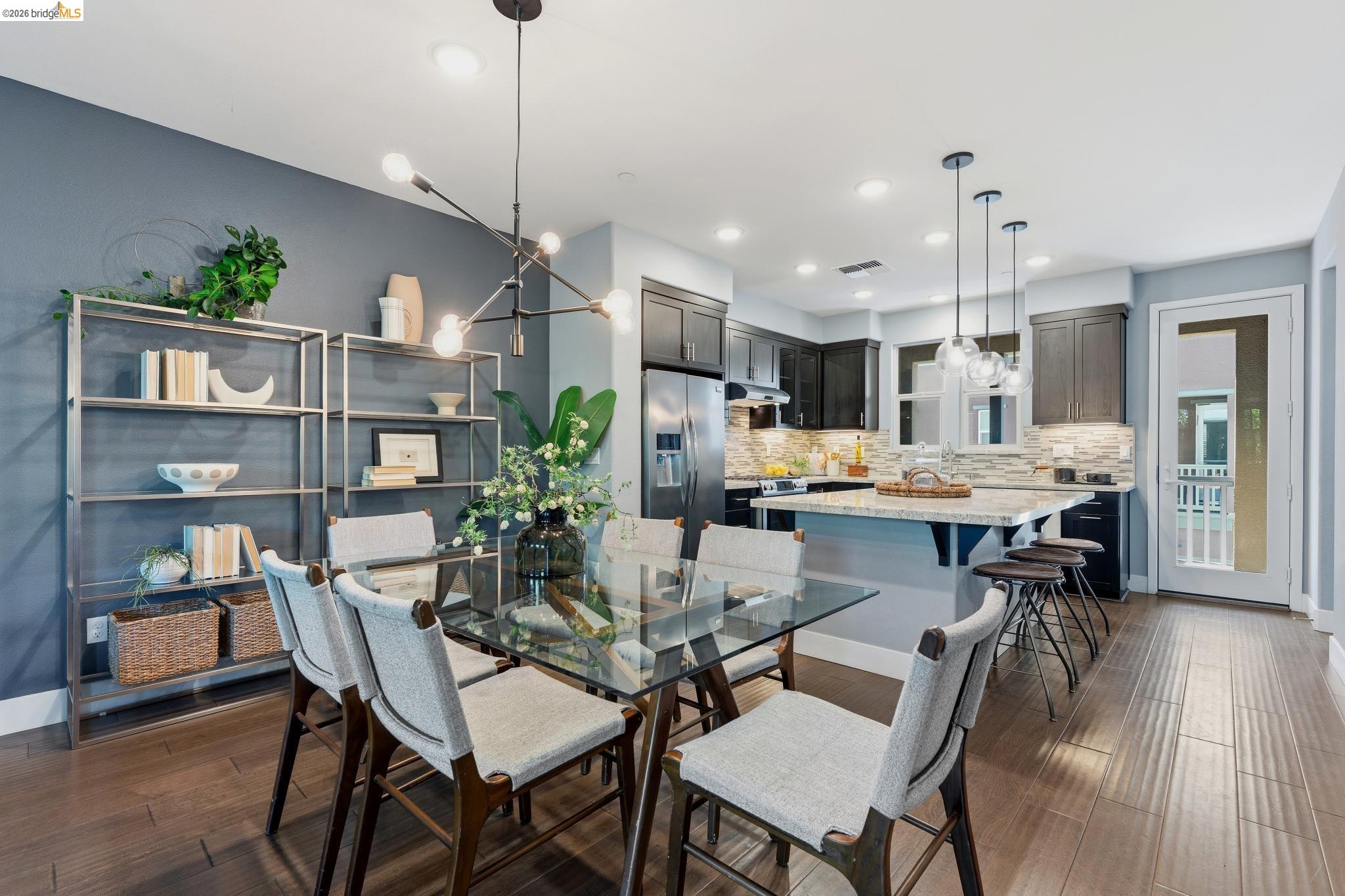 489 Diller Street Alameda, CA 94501 - Photo 4 of 60 Dining space with a chandelier and dark wood-style flooring