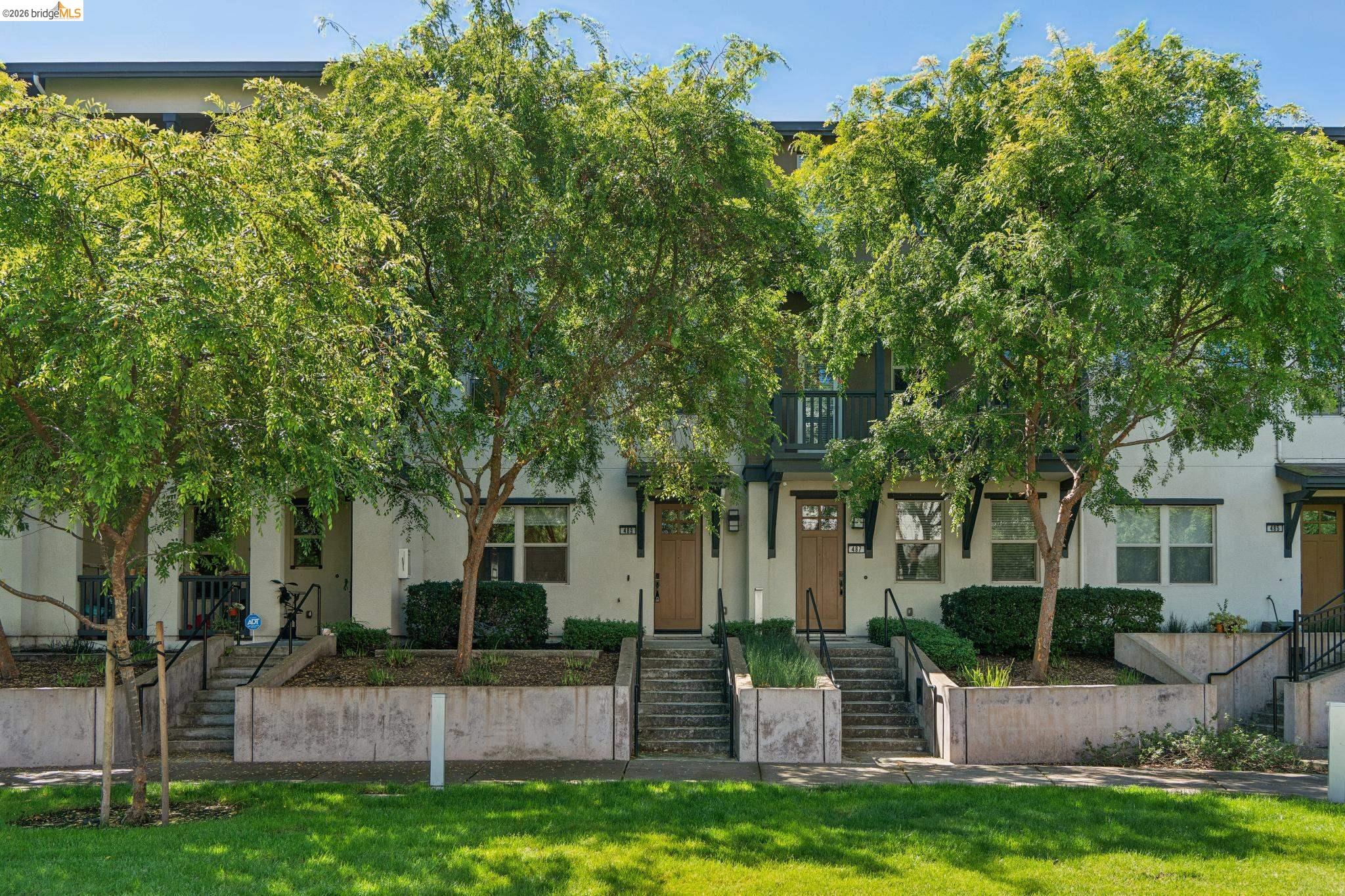 489 Diller Street Alameda, CA 94501 - Photo 50 of 60 View of property hidden behind natural elements with stucco siding and a balcony