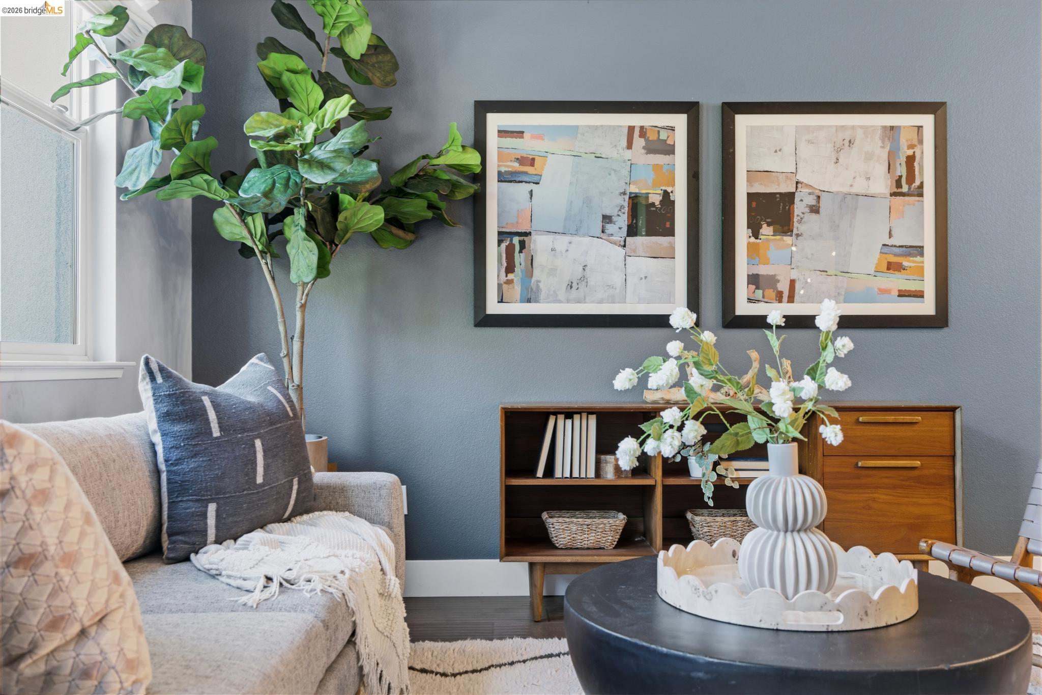 489 Diller Street Alameda, CA 94501 - Photo 8 of 60 Living area featuring baseboards and wood finished floors