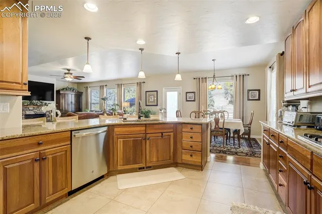 a large kitchen with lots of counter space and sink