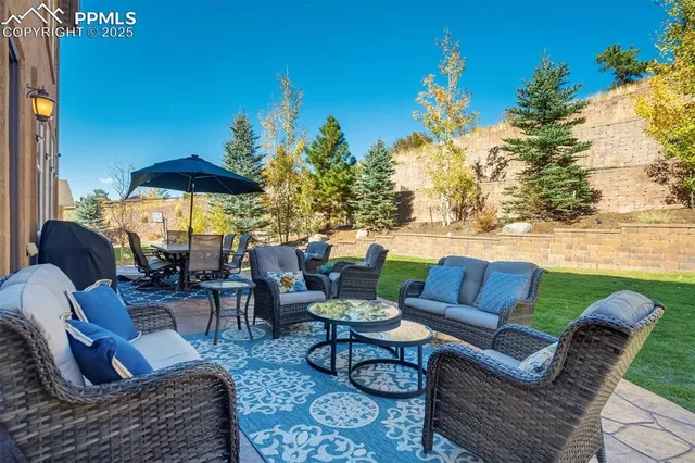 a outdoor living space with furniture and city view