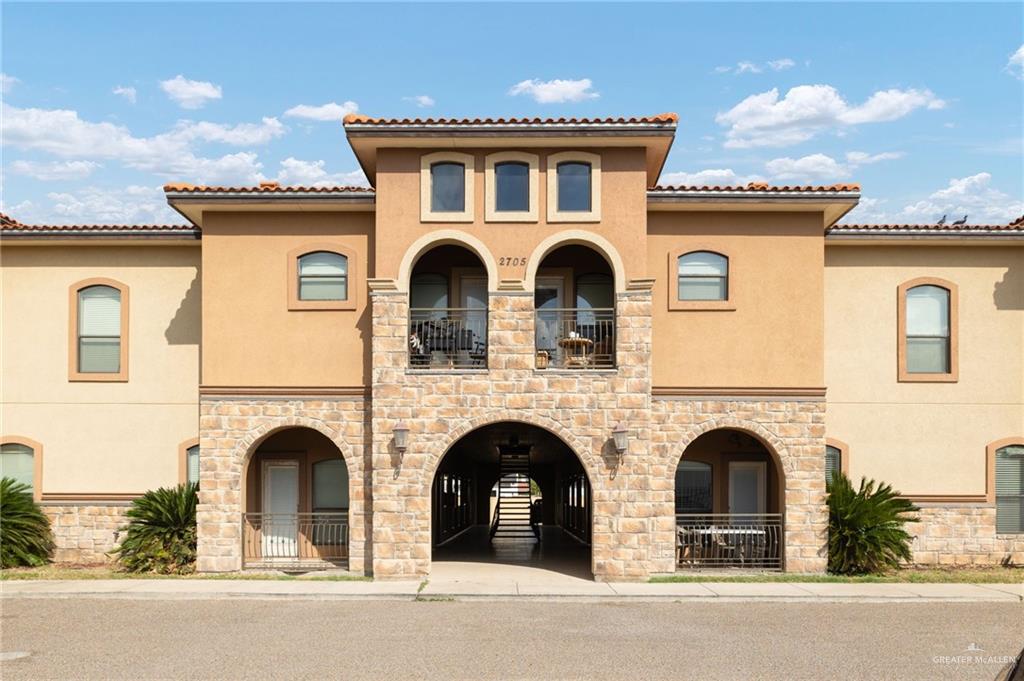 a front view of a house with garage