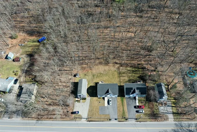 an aerial view of a house with a ocean view