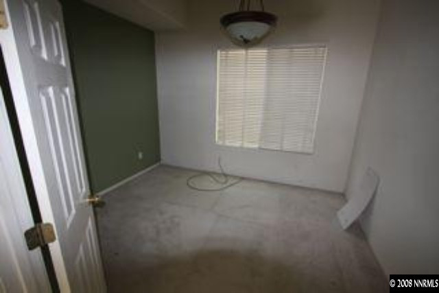 1113 Tule Drive Reno, NV 89521 - Photo 7 of 8 a view of an empty room with a window
