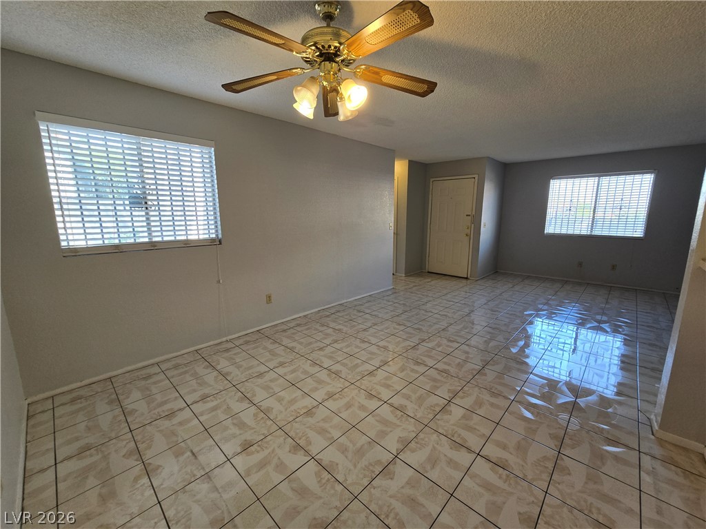 6750 Del Rey Avenue, Unit 133 Las Vegas, NV 89146 - Photo 6 of 34 A living area with cool tile floors for easy maintenance and a refreshing ambiance.