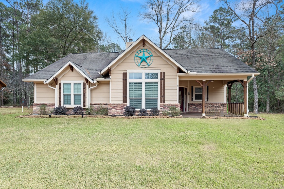 4985 Fm 2827 Road Warren, TX 77664 - Photo 1 of 41 a front view of house with yard and green space