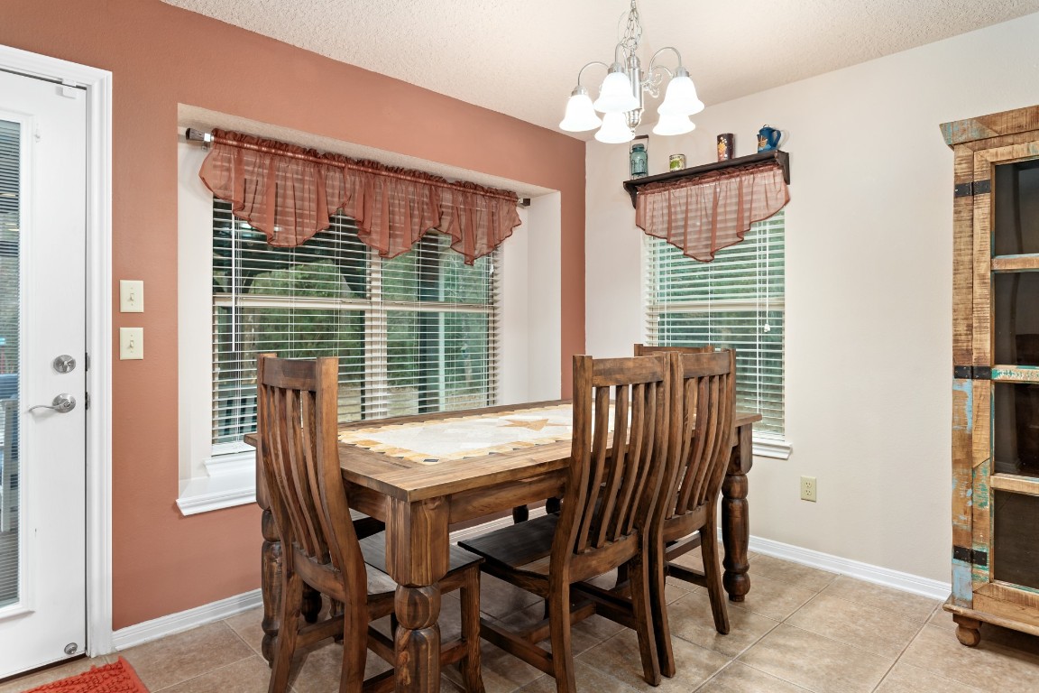4985 Fm 2827 Road Warren, TX 77664 - Photo 12 of 41 a view of a dining room with furniture and window