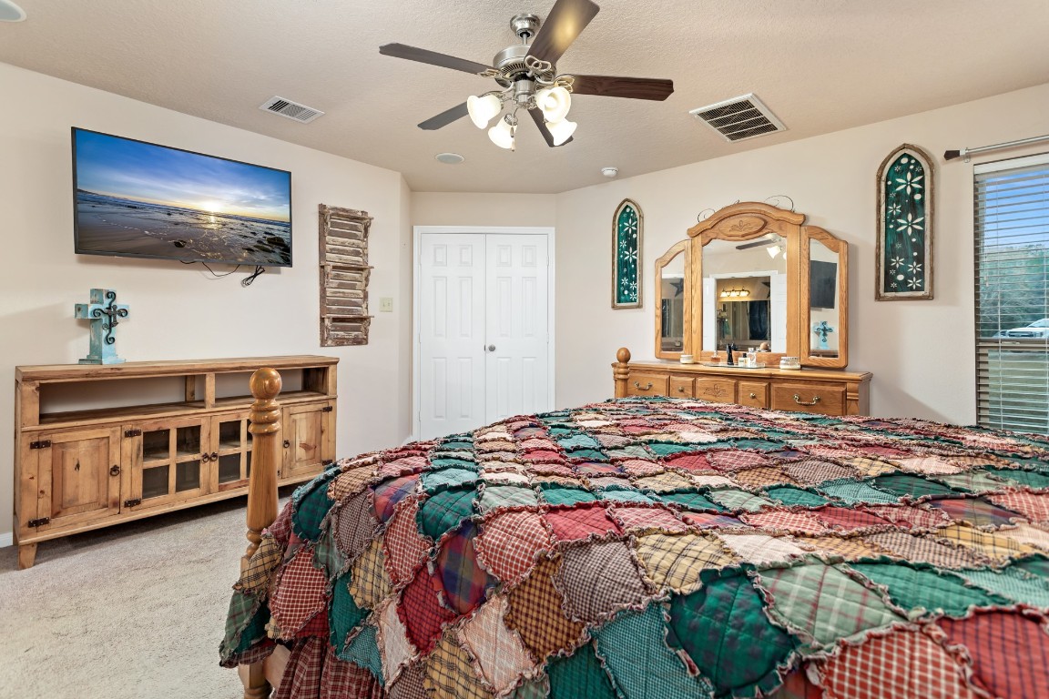 4985 Fm 2827 Road Warren, TX 77664 - Photo 17 of 41 a bedroom with a bed and a flat screen tv