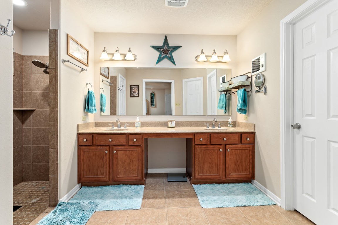 4985 Fm 2827 Road Warren, TX 77664 - Photo 18 of 41 a bathroom with a sink and a mirror