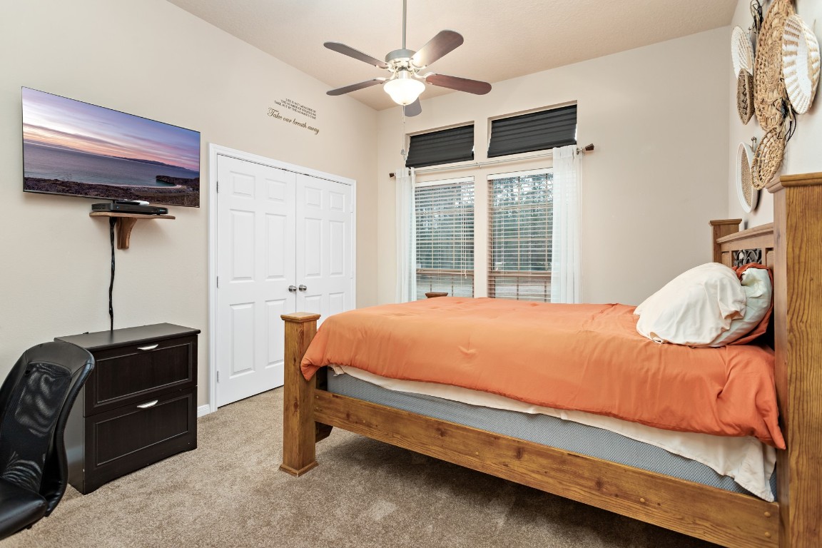 4985 Fm 2827 Road Warren, TX 77664 - Photo 24 of 41 a bed room with a bed and a ceiling fan