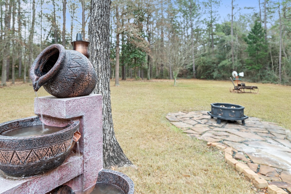 4985 Fm 2827 Road Warren, TX 77664 - Photo 27 of 41 a swimming pool with some trees and wooden fence