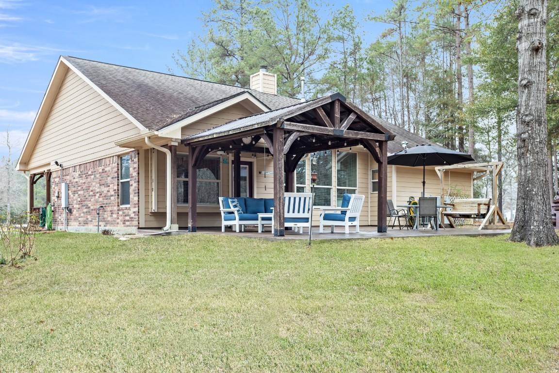 4985 Fm 2827 Road Warren, TX 77664 - Photo 29 of 41 a view of a house with swimming pool and porch with furniture