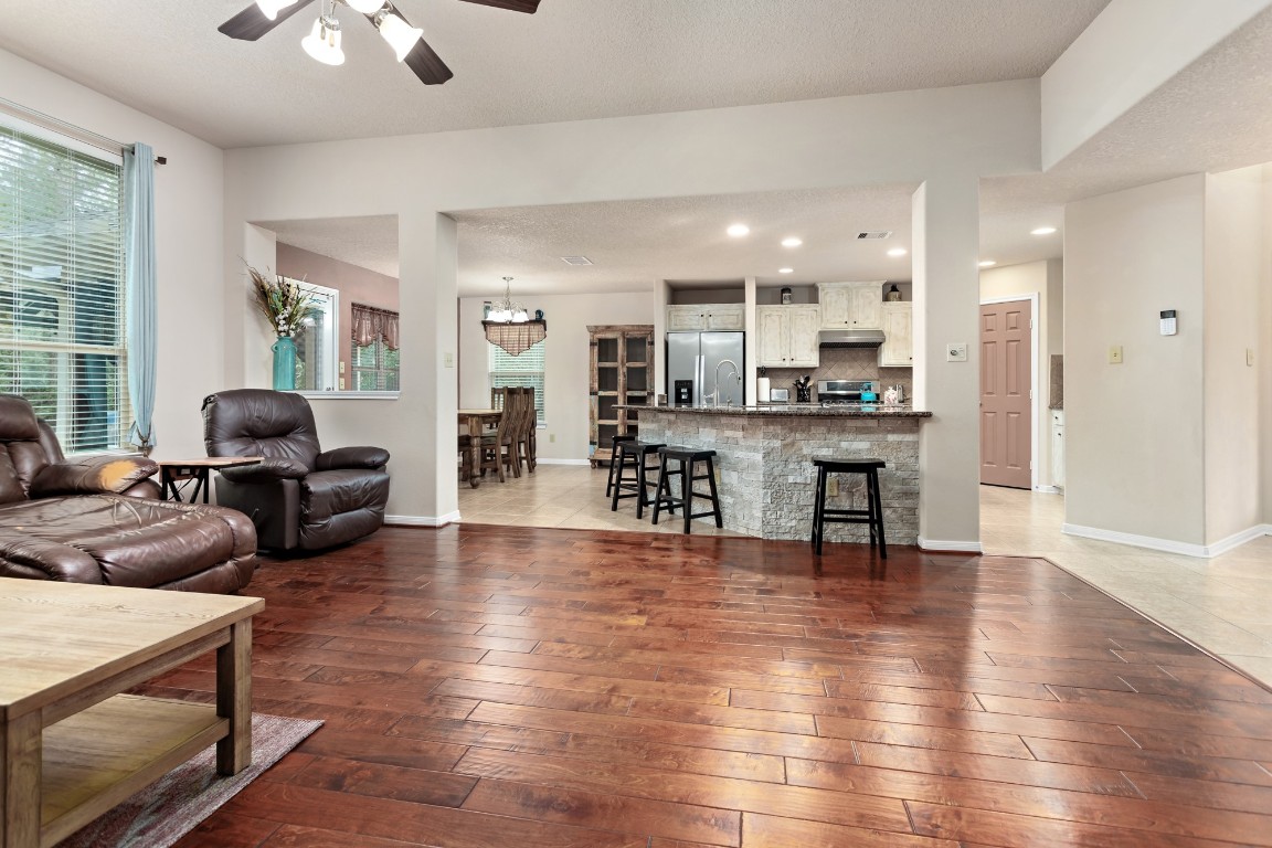4985 Fm 2827 Road Warren, TX 77664 - Photo 7 of 41 a living room with couches and kitchen view with wooden floor