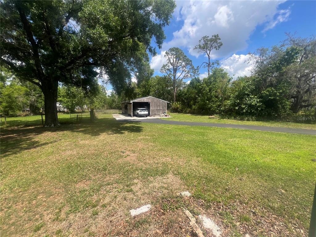 5855 Jack Brack Road St. Cloud, FL 34771 - Photo 86 of 86 a view of a playground with basketball court