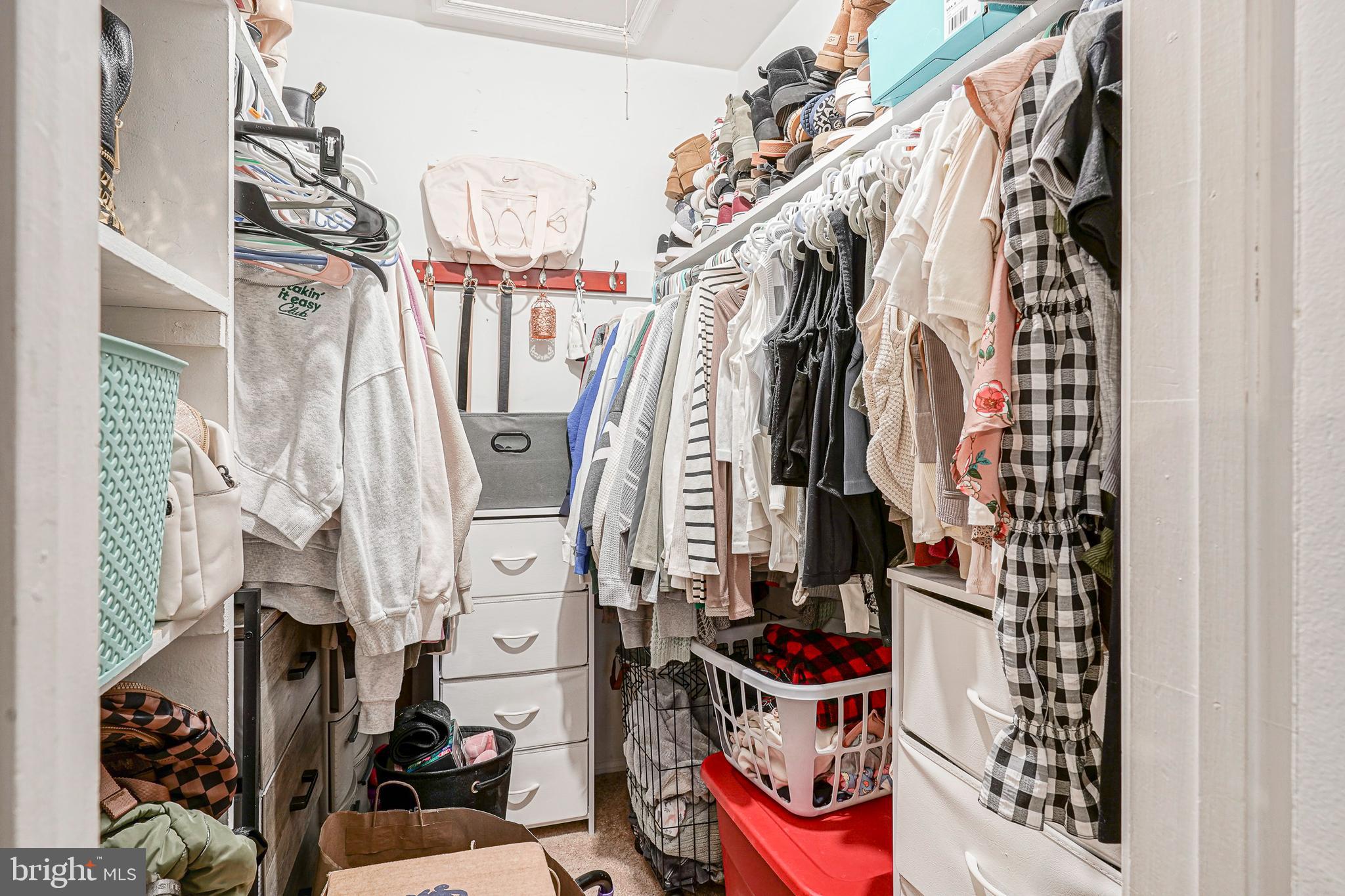 2402 Sedgefield Drive Mount Laurel, NJ 08054 - Photo 14 of 22 a view of walk in closet with clothes and shoes