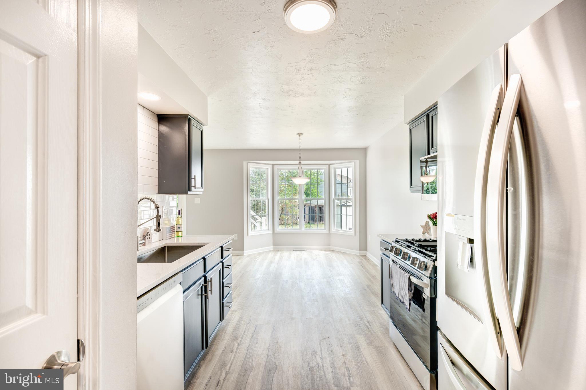 159 Colorado Avenue Littlestown, PA 17340 - Photo 19 of 47 a kitchen with stainless steel appliances a sink stove and refrigerator