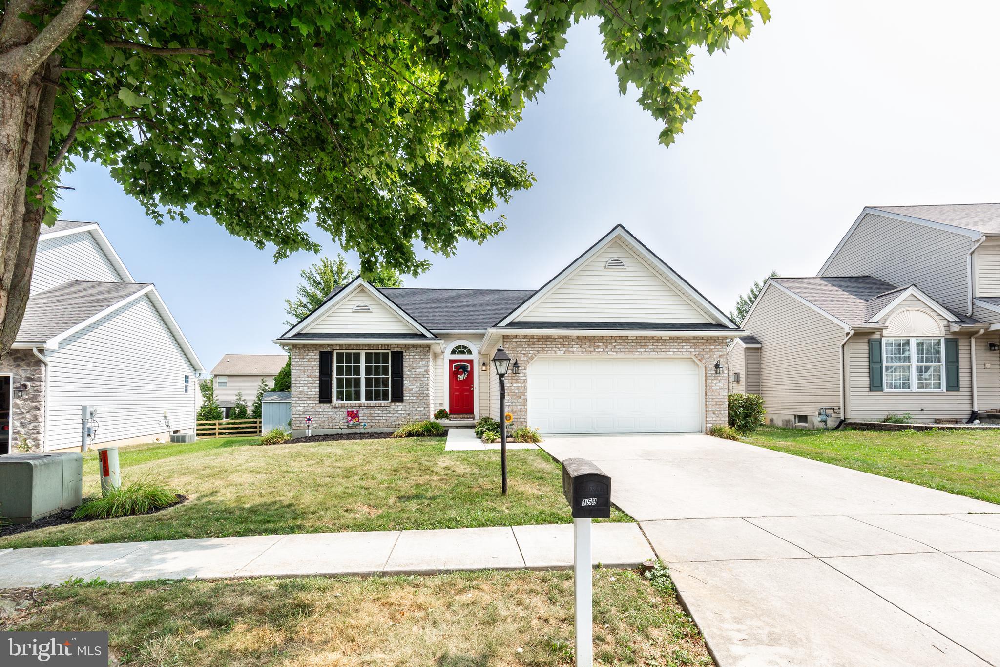 159 Colorado Avenue Littlestown, PA 17340 - Photo 2 of 47 a front view of a house with a yard and garage