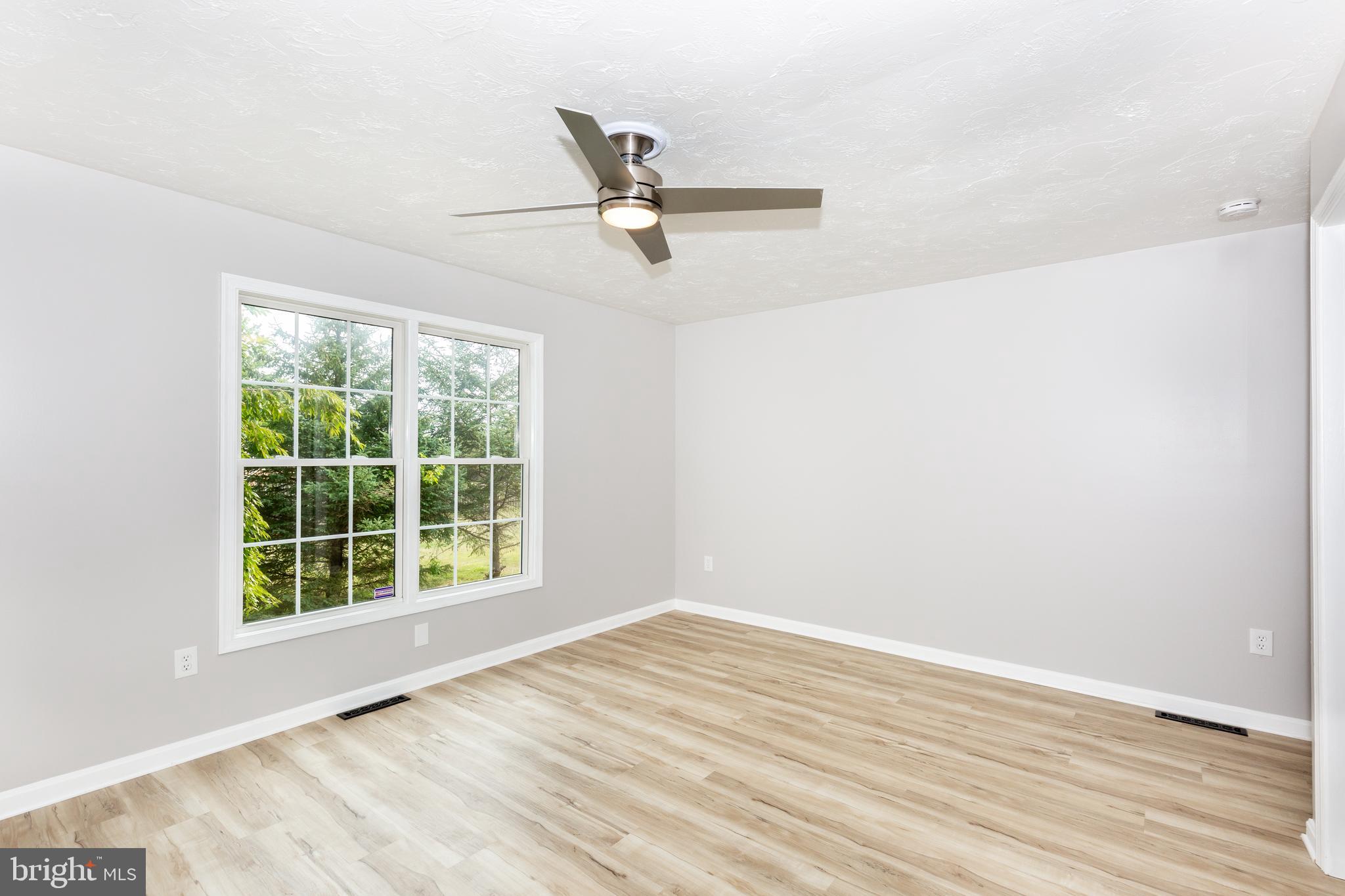 159 Colorado Avenue Littlestown, PA 17340 - Photo 25 of 47 an empty room with wooden floor and windows