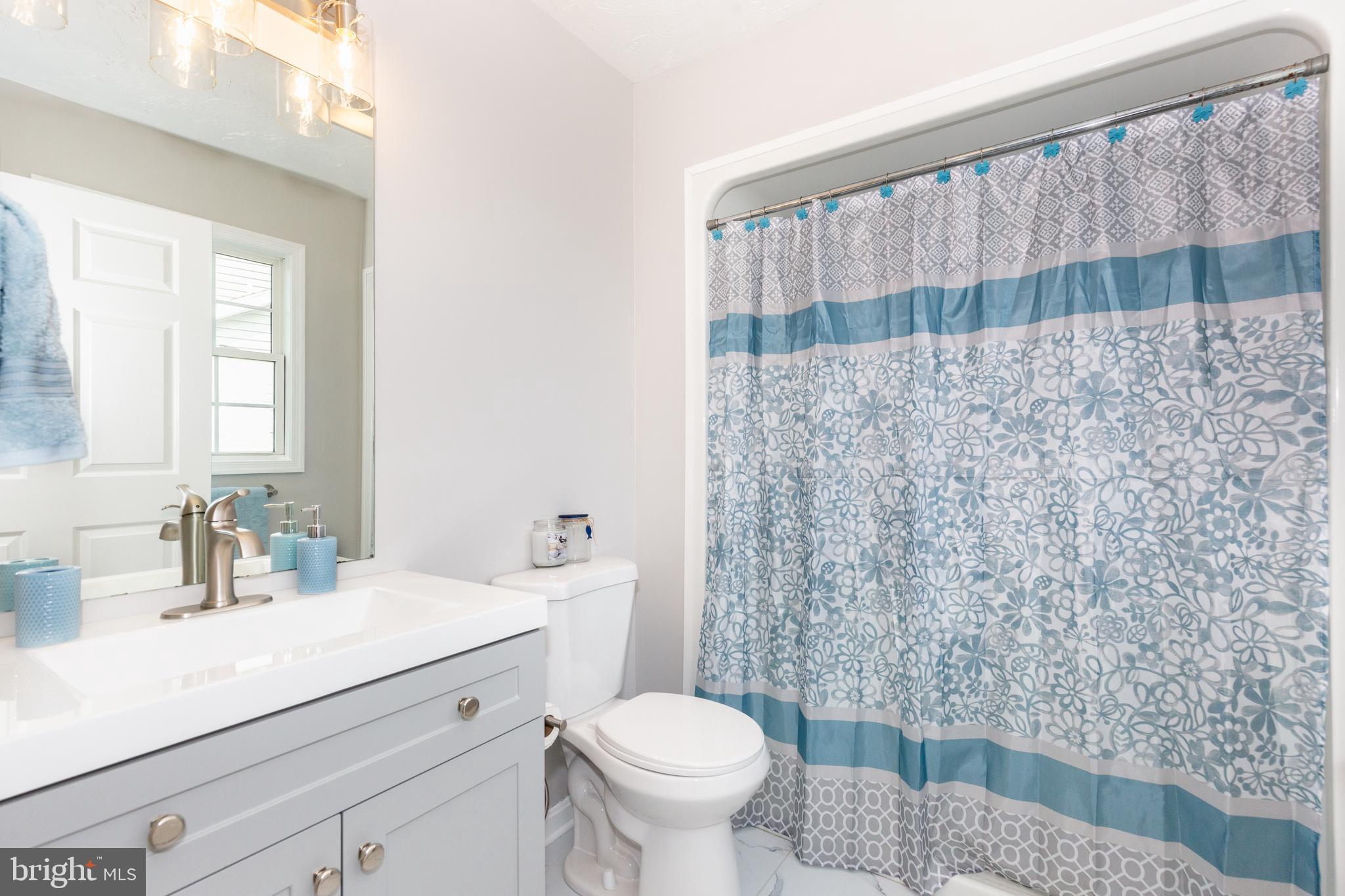 159 Colorado Avenue Littlestown, PA 17340 - Photo 27 of 47 a bathroom with a sink a toilet and a mirror