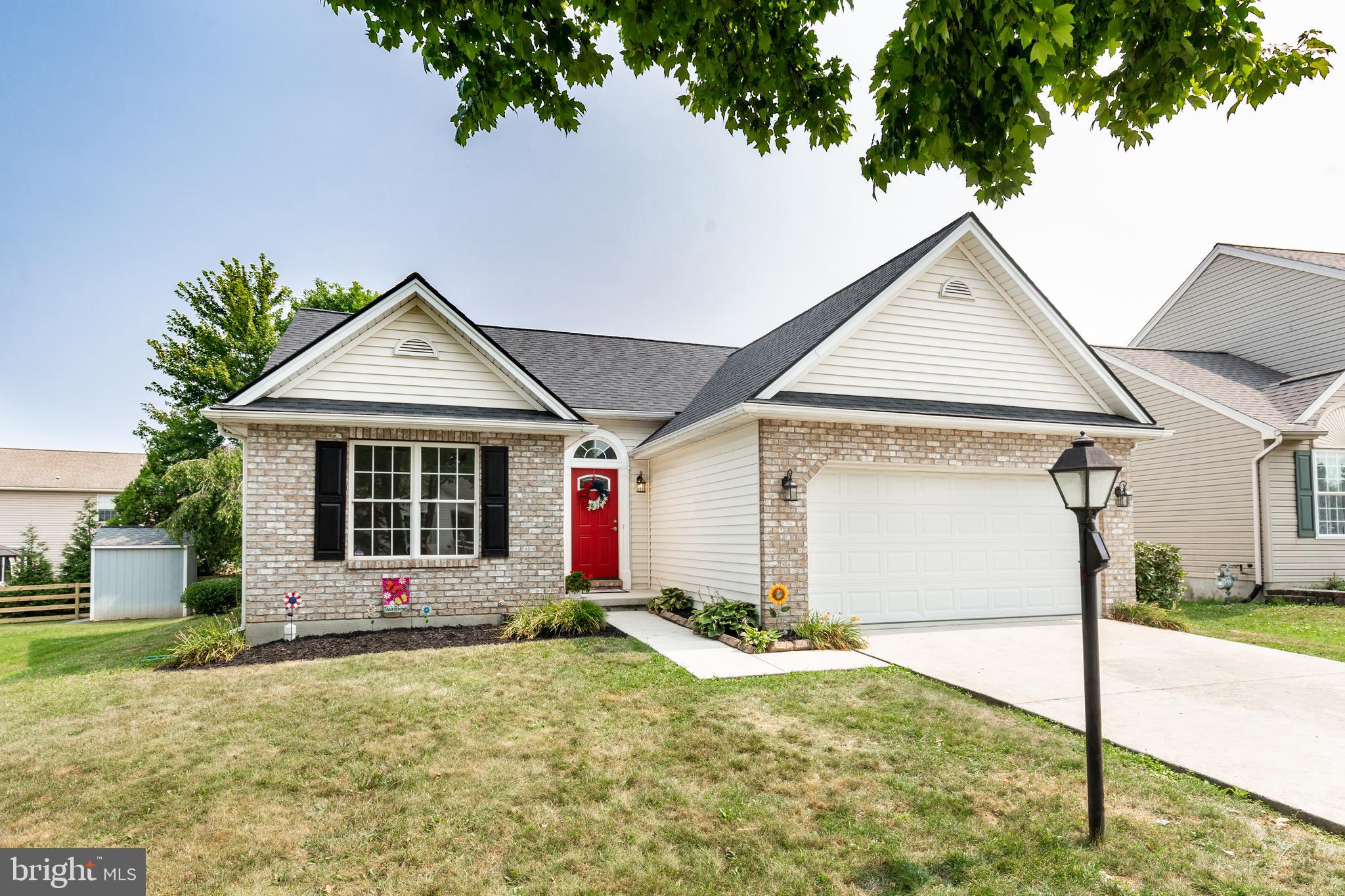 159 Colorado Avenue Littlestown, PA 17340 - Photo 3 of 47 a front view of a house with a yard and garage