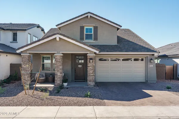 a front view of a house with garage