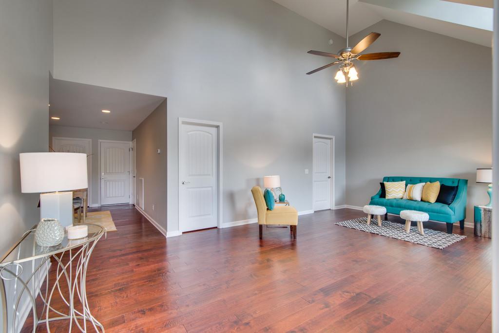 1016 Glendale Road Dickson, TN 37055 - Photo 3 of 28 a living room with furniture and a lamp