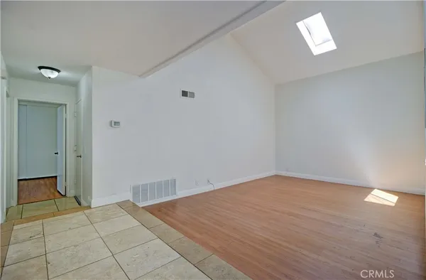a view of entryway and hall with a front door