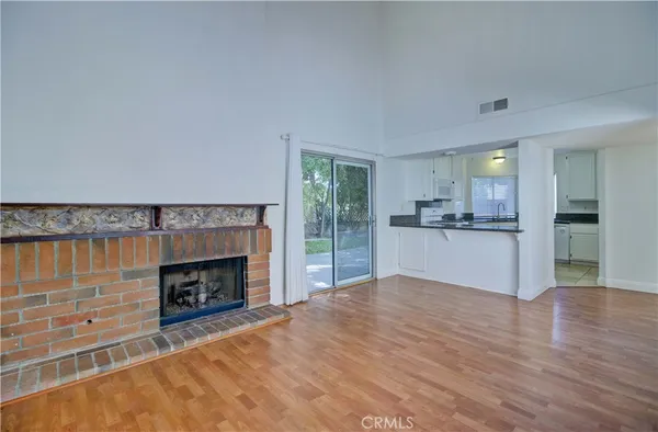 a view of large kitchen with a sink and dishwasher