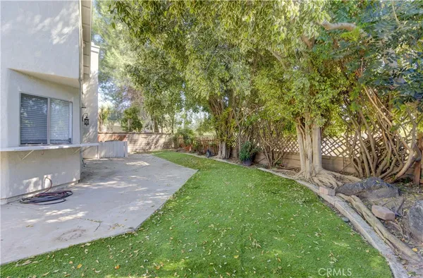 a house with potted plants in front of it