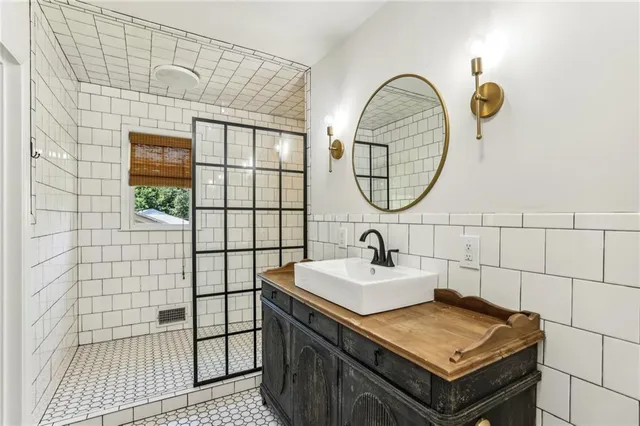 a bathroom with a sink and a mirror