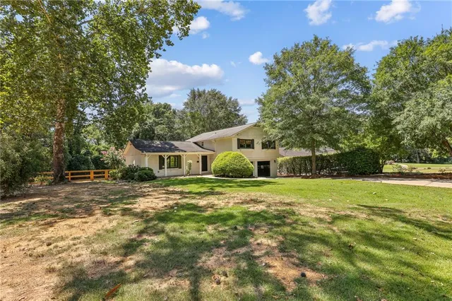 a view of a big yard next to a house