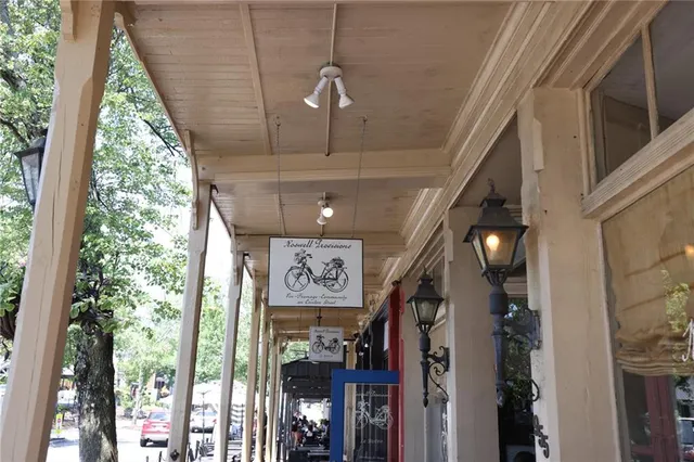 a view of a patio with table and chairs and potted plants