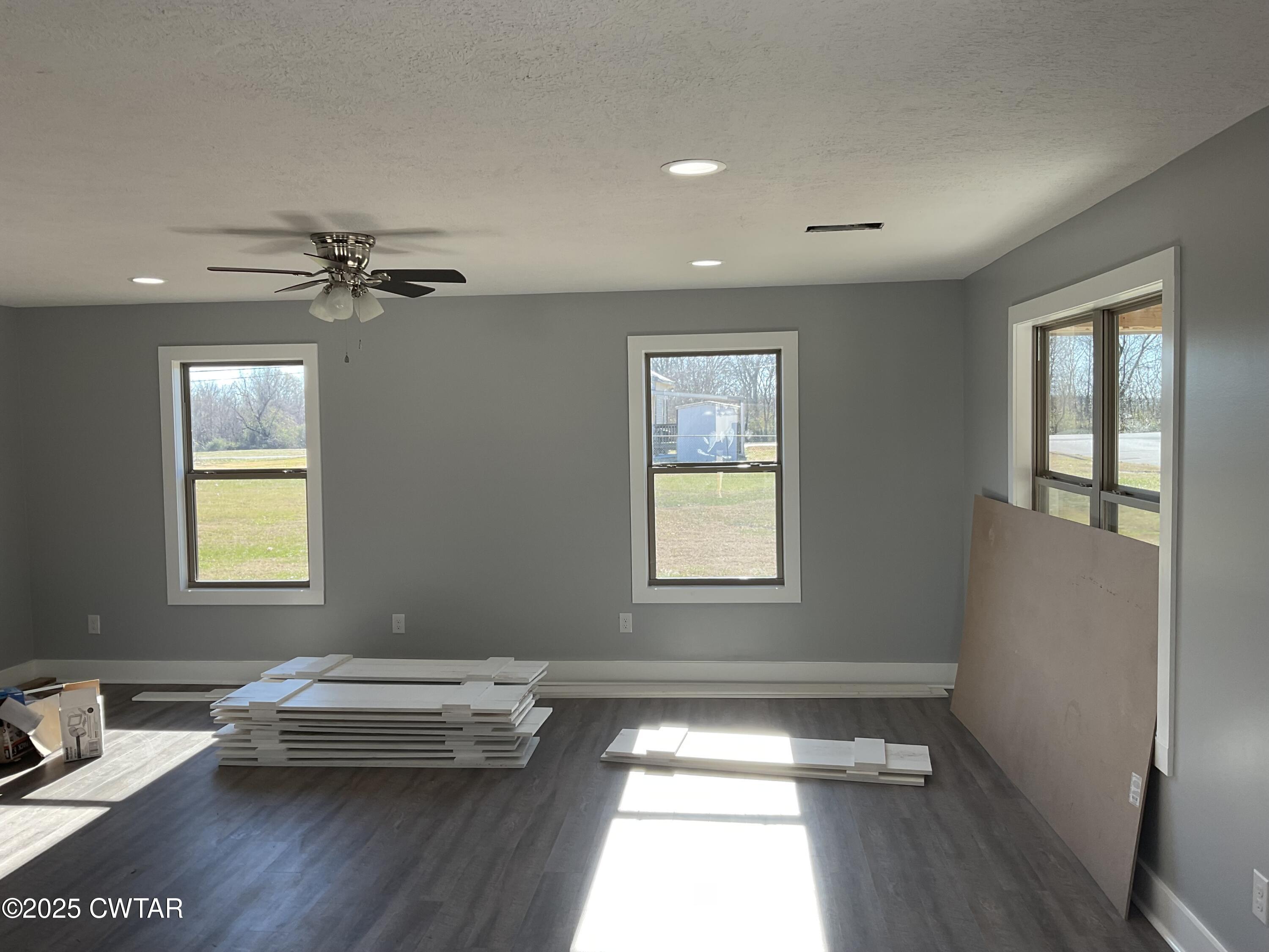 306 Mobile Street Jackson, TN 38301 - Photo 3 of 10 a view of livingroom with hardwood floor and a window