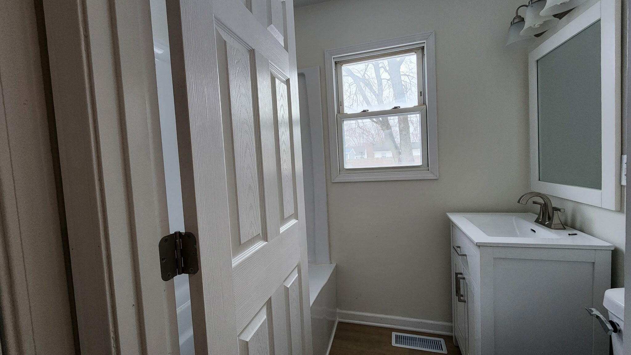 723 Fox River Road Valparaiso, IN 46385 - Photo 13 of 13 a bathroom with a sink a toilet and a mirror
