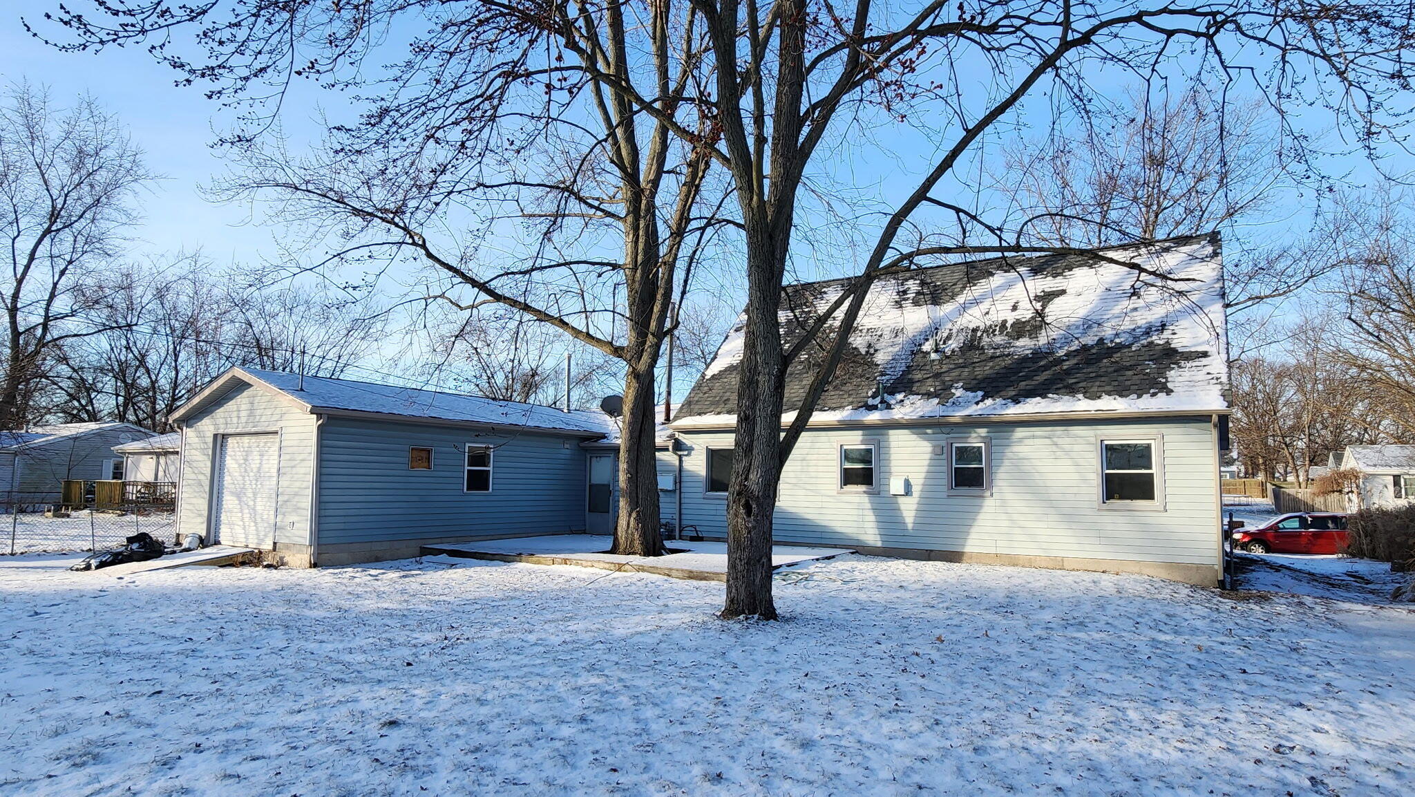 723 Fox River Road Valparaiso, IN 46385 - Photo 2 of 13 a view of a house with a yard and garage