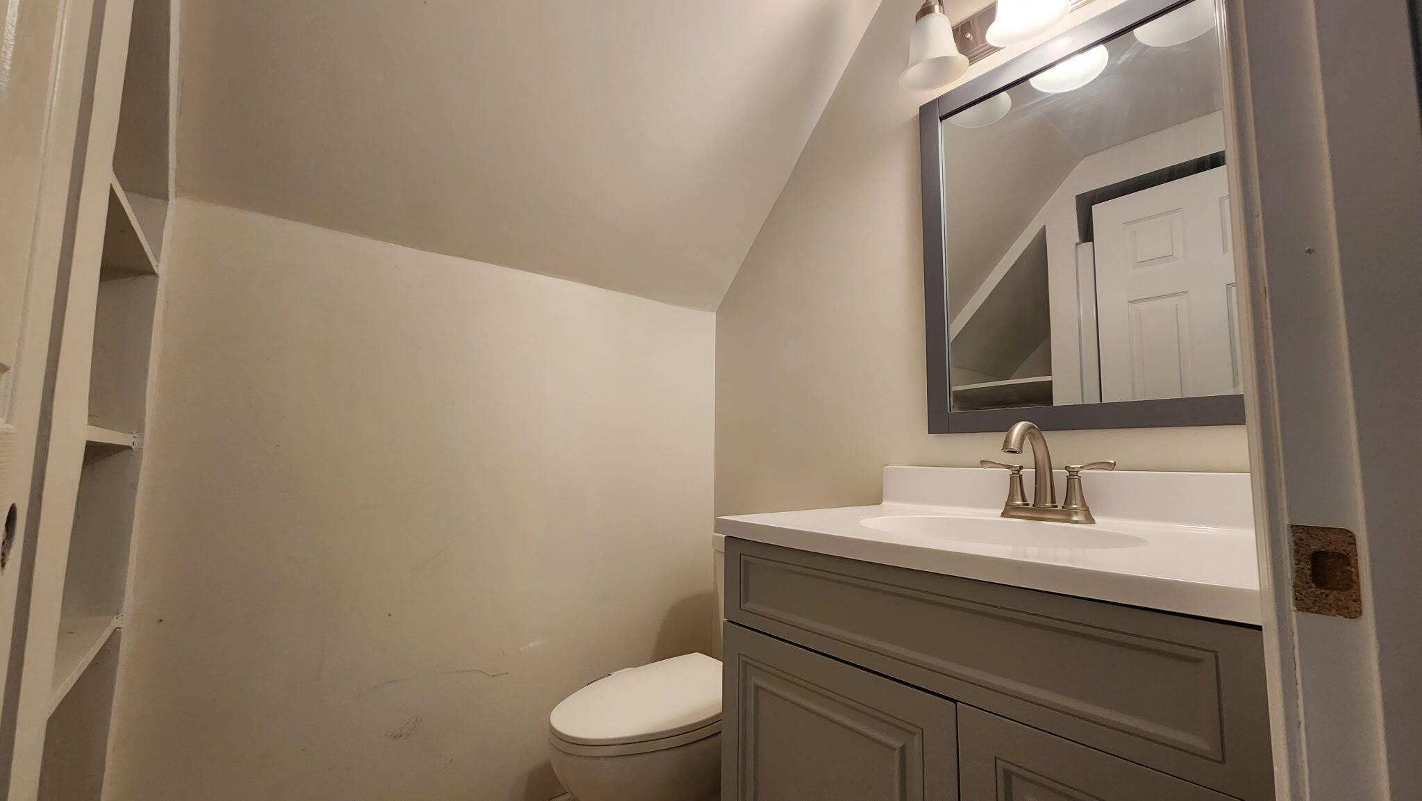 723 Fox River Road Valparaiso, IN 46385 - Photo 4 of 13 a bathroom with a toilet a sink and mirror