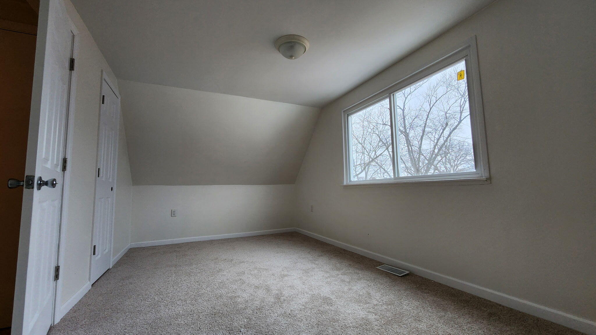 723 Fox River Road Valparaiso, IN 46385 - Photo 5 of 13 an empty room with a window