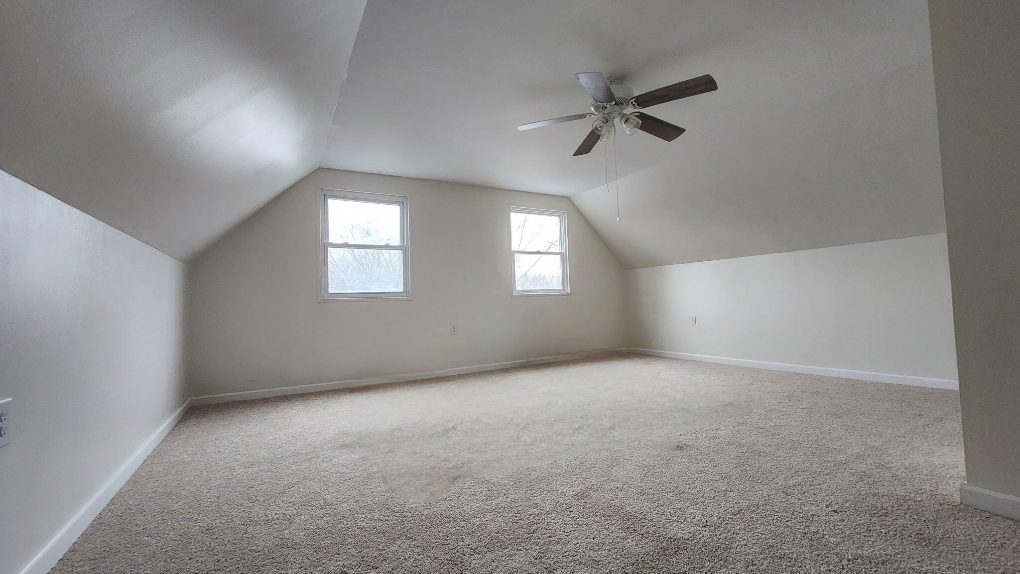 723 Fox River Road Valparaiso, IN 46385 - Photo 6 of 13 a view of an empty room with a window