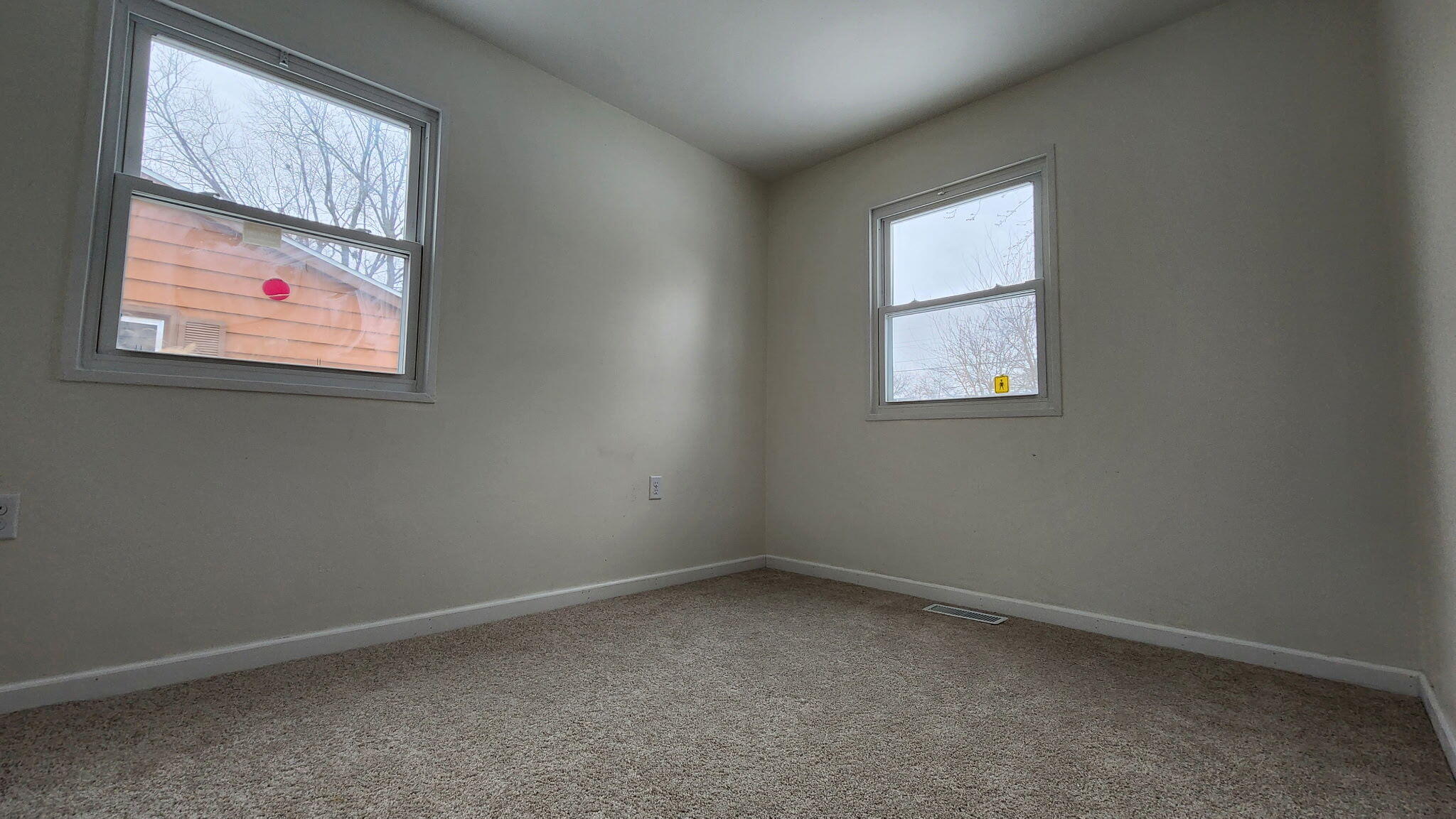 723 Fox River Road Valparaiso, IN 46385 - Photo 7 of 13 an empty room with windows