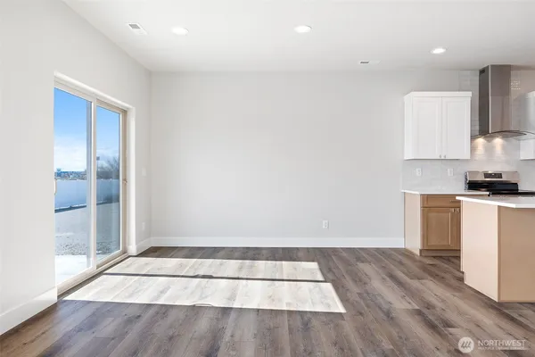 a view of kitchen with wooden floor