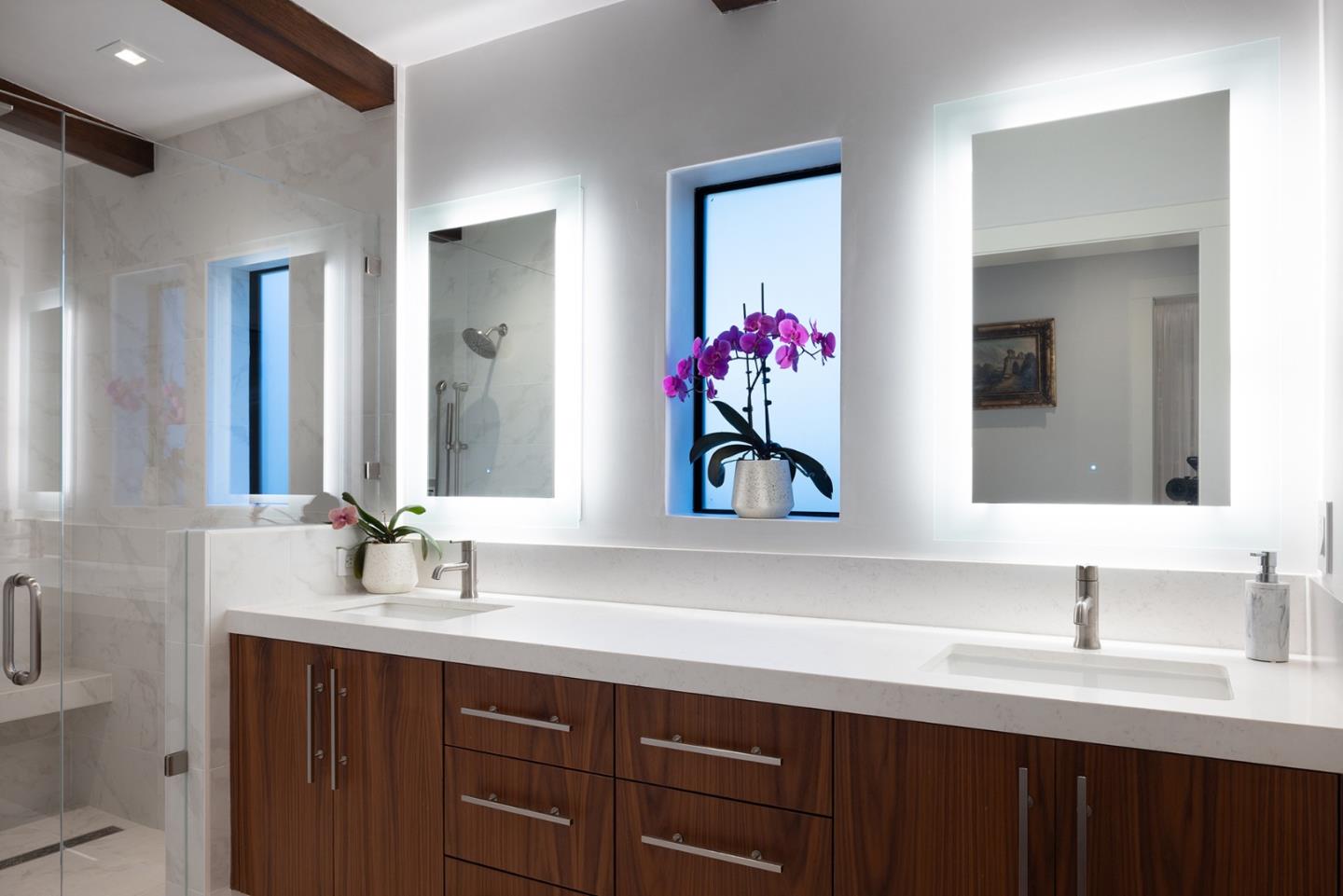 2931 Sloat Road Pebble Beach, CA 93953 - Photo 12 of 34 a bathroom with a sink vanity and mirror