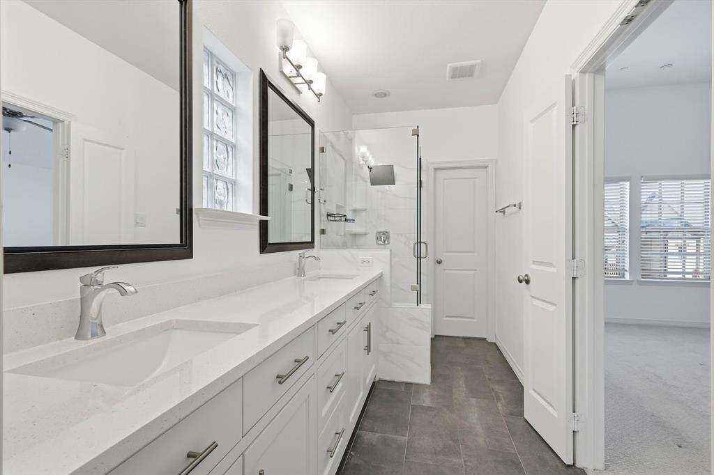228 Skystone Drive Irving, TX 75038 - Photo 13 of 28 a spacious bathroom with a double vanity sink mirror and double
