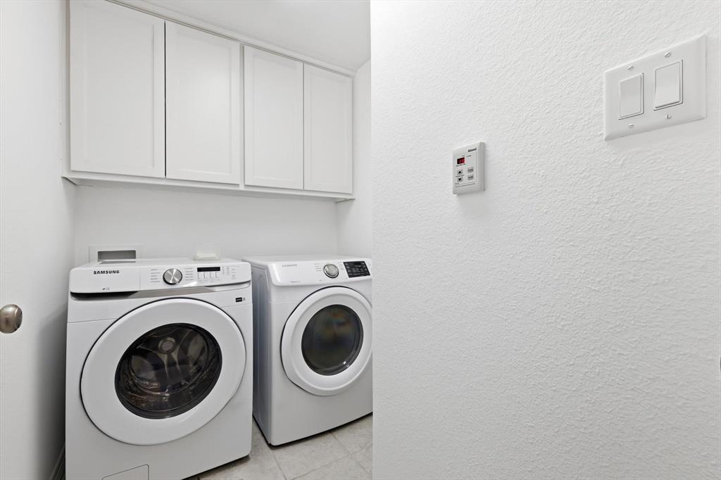 228 Skystone Drive Irving, TX 75038 - Photo 16 of 28 a utility room with dryer and washer