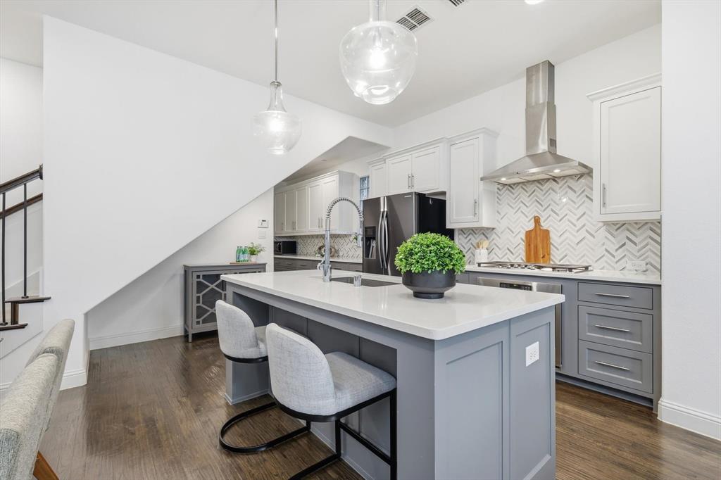 228 Skystone Drive Irving, TX 75038 - Photo 4 of 28 a kitchen with stainless steel appliances a sink and stove