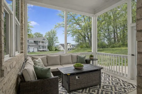 a outdoor living space with furniture and a potted plant