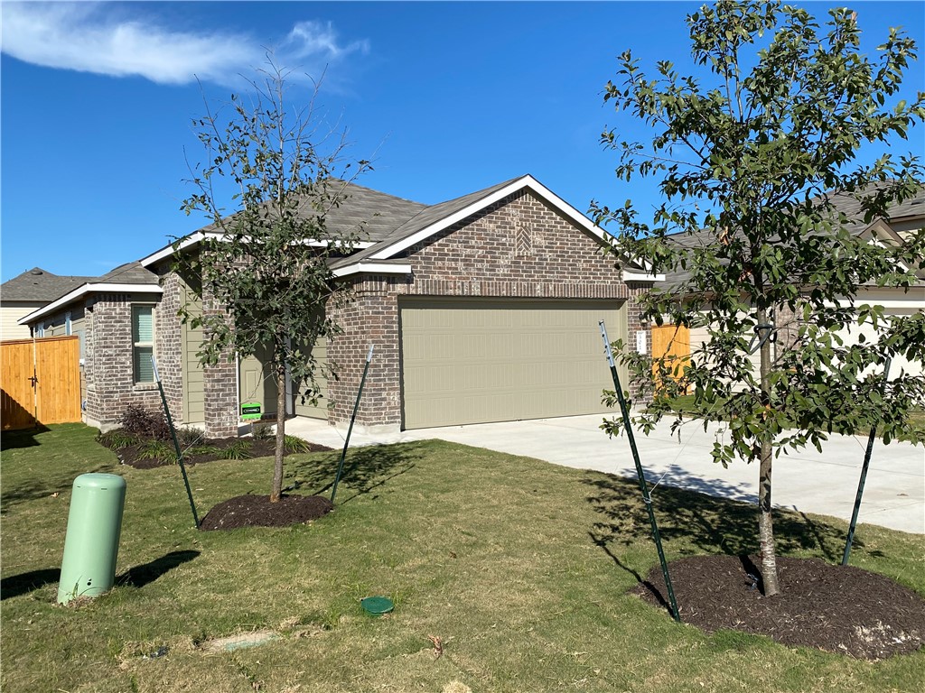 301 Greatest Gift Way Jarrell, TX 76537 - Photo 2 of 20 a view of backyard of a house