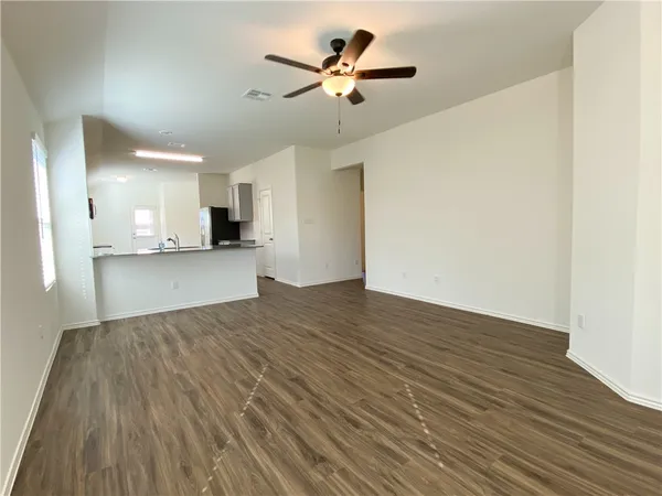 a view of a kitchen with a sink and a dishwasher