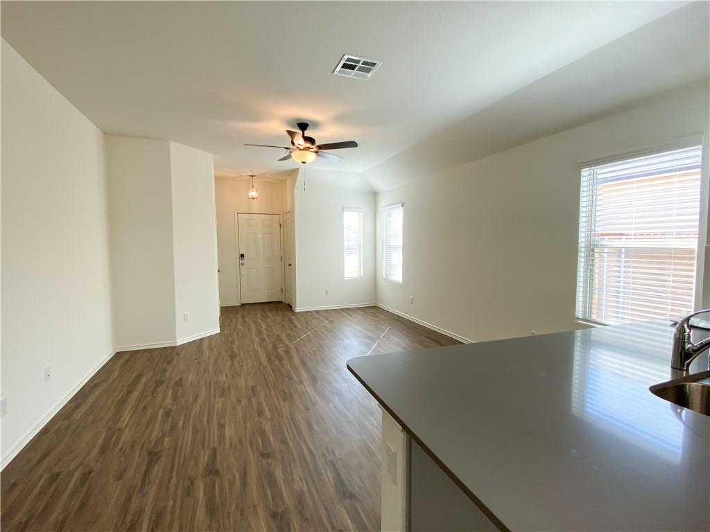 301 Greatest Gift Way Jarrell, TX 76537 - Photo 6 of 20 a view of empty room with wooden floor and fan