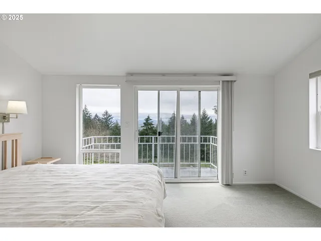 a bathroom with a sink toilet a mirror and window